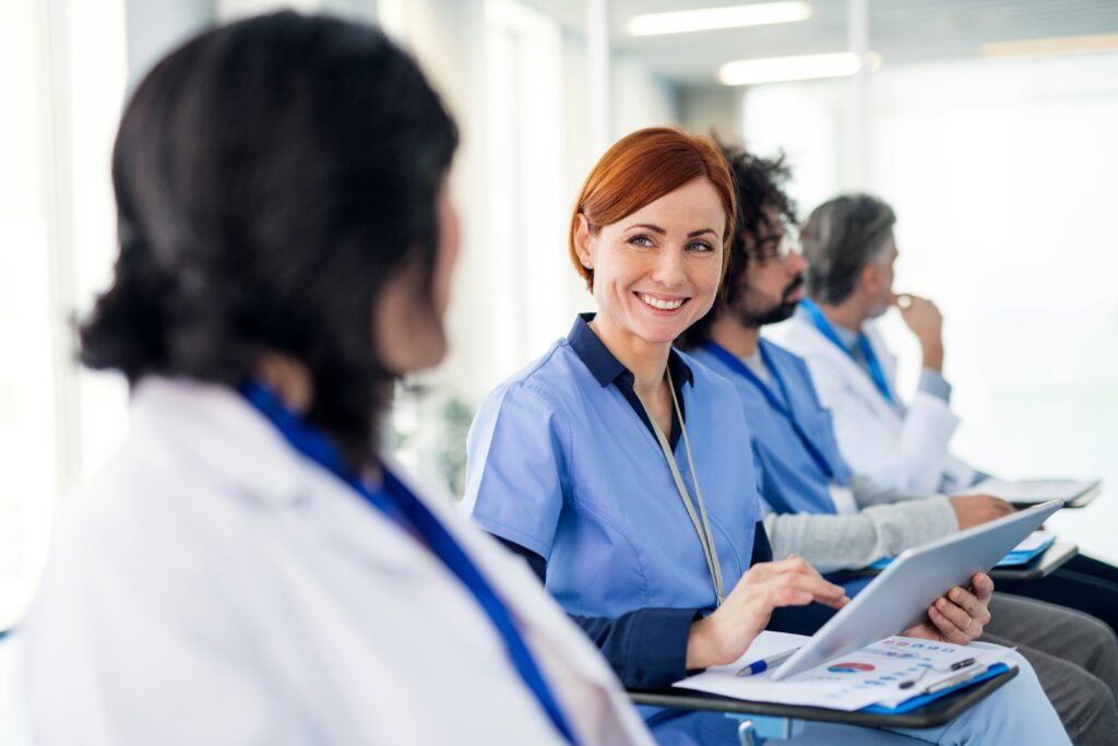 Medical professionals participating in cadaver-based aesthetic injection training